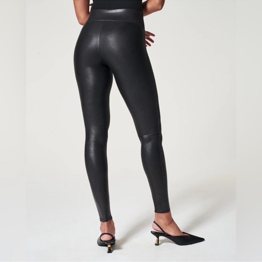 Gently worn black faux leather leggings